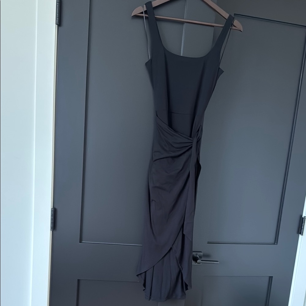 Ricki’s Elegant Black Sleeveless Wrap Dress